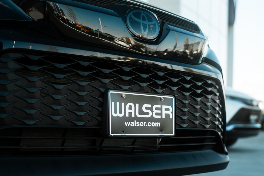A Walser License Plate on a Black Camry